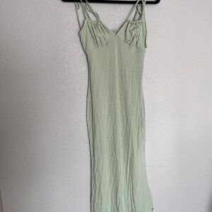 Mint pastel green dress. Fits to silhouette.